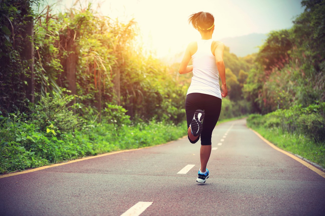 Young Fitness Woman Runner Running On Trail